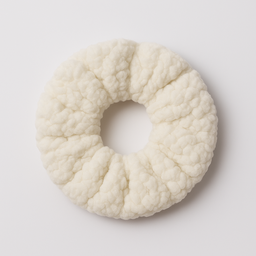 White textured scrunchie on a light gray background