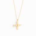 Gold cross-shaped pendant necklace on a white background