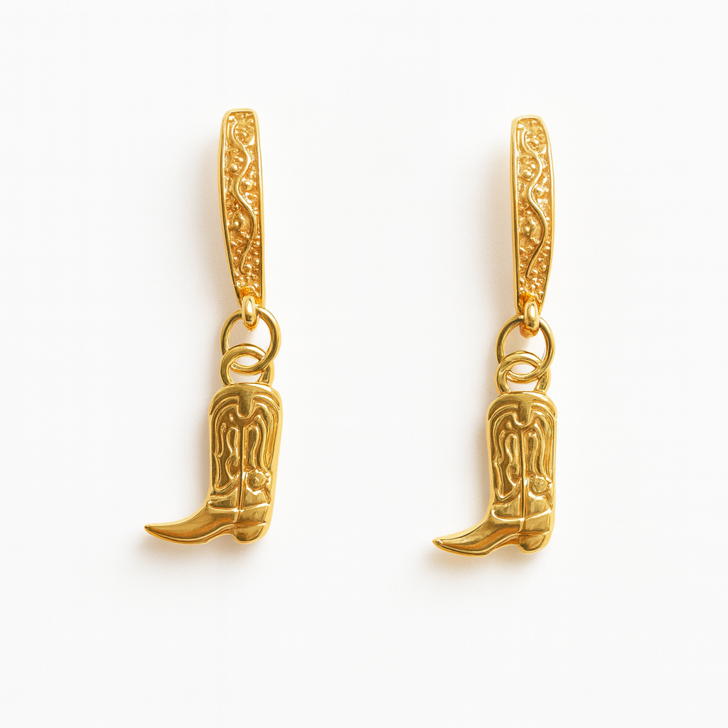 Gold cowboy boot earrings on a white background