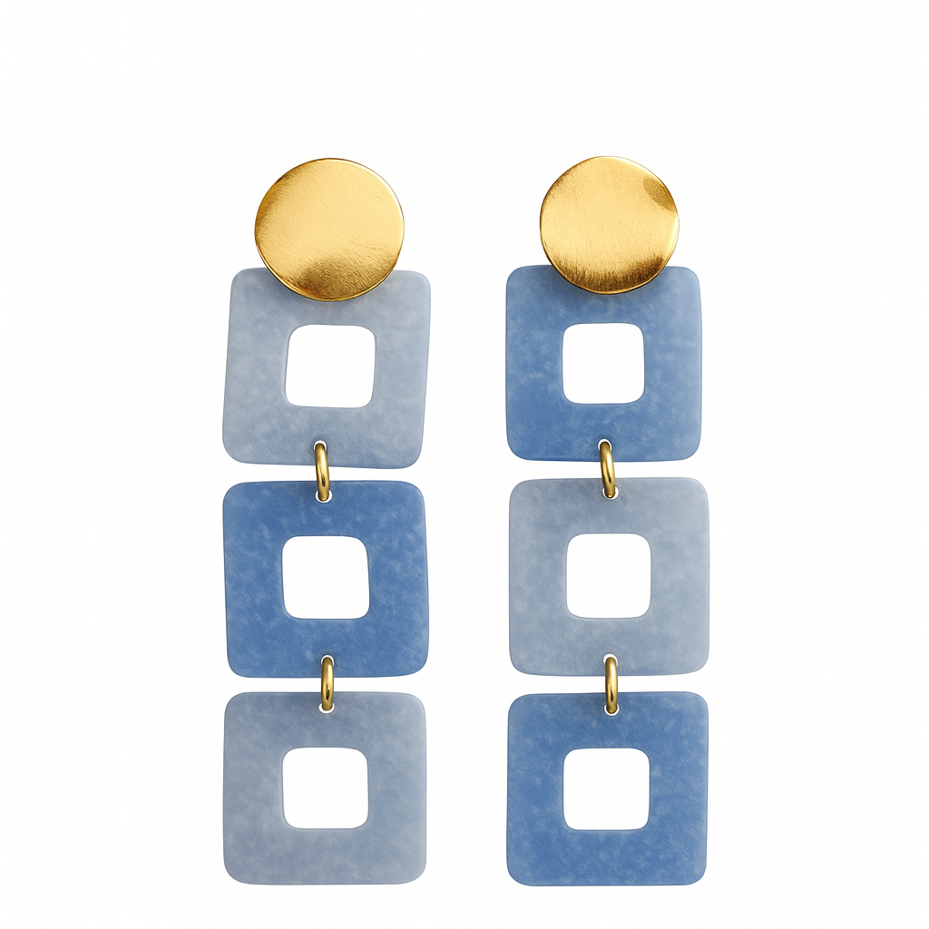 Pair of earrings with gold and blue geometric design on a white background