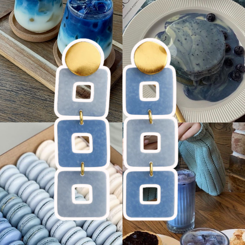 Collage of blue-themed items including drinks, macarons, and a cupcake on a wooden table.