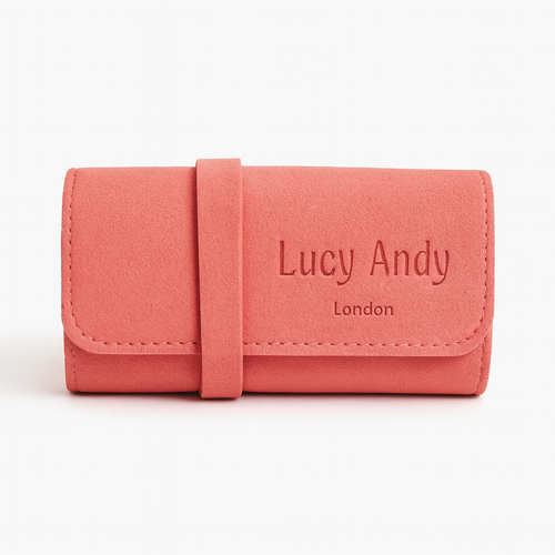 Pink wallet with 'Lucy Andy London' branding on a white background