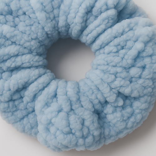 Light blue fleece scrunchie on a white background
