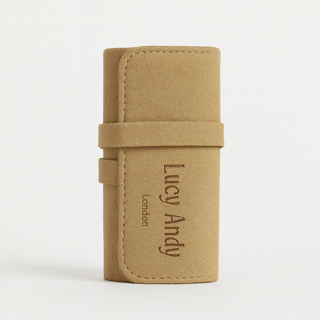 Tan leather case with 'Lucy Andy' branding on a white background