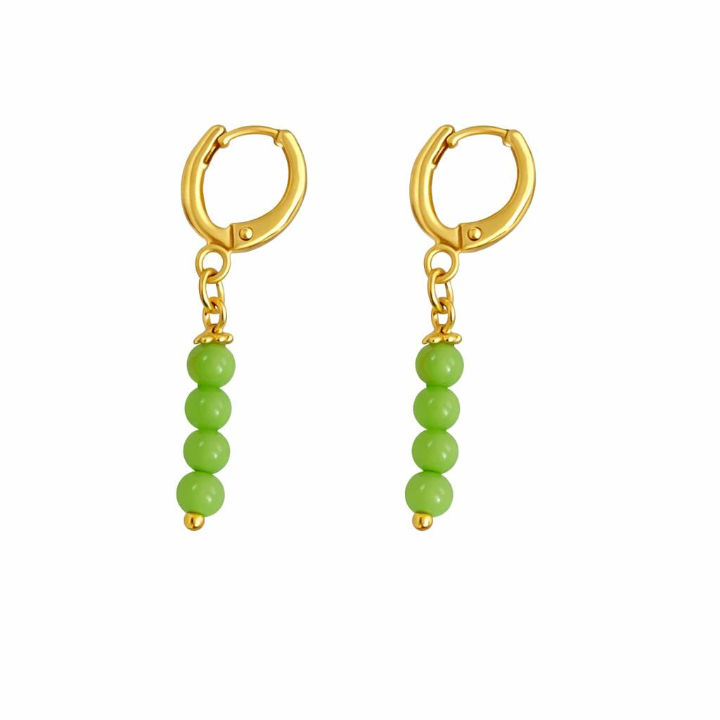 Gold hoop earrings with green bead drops on a white background
