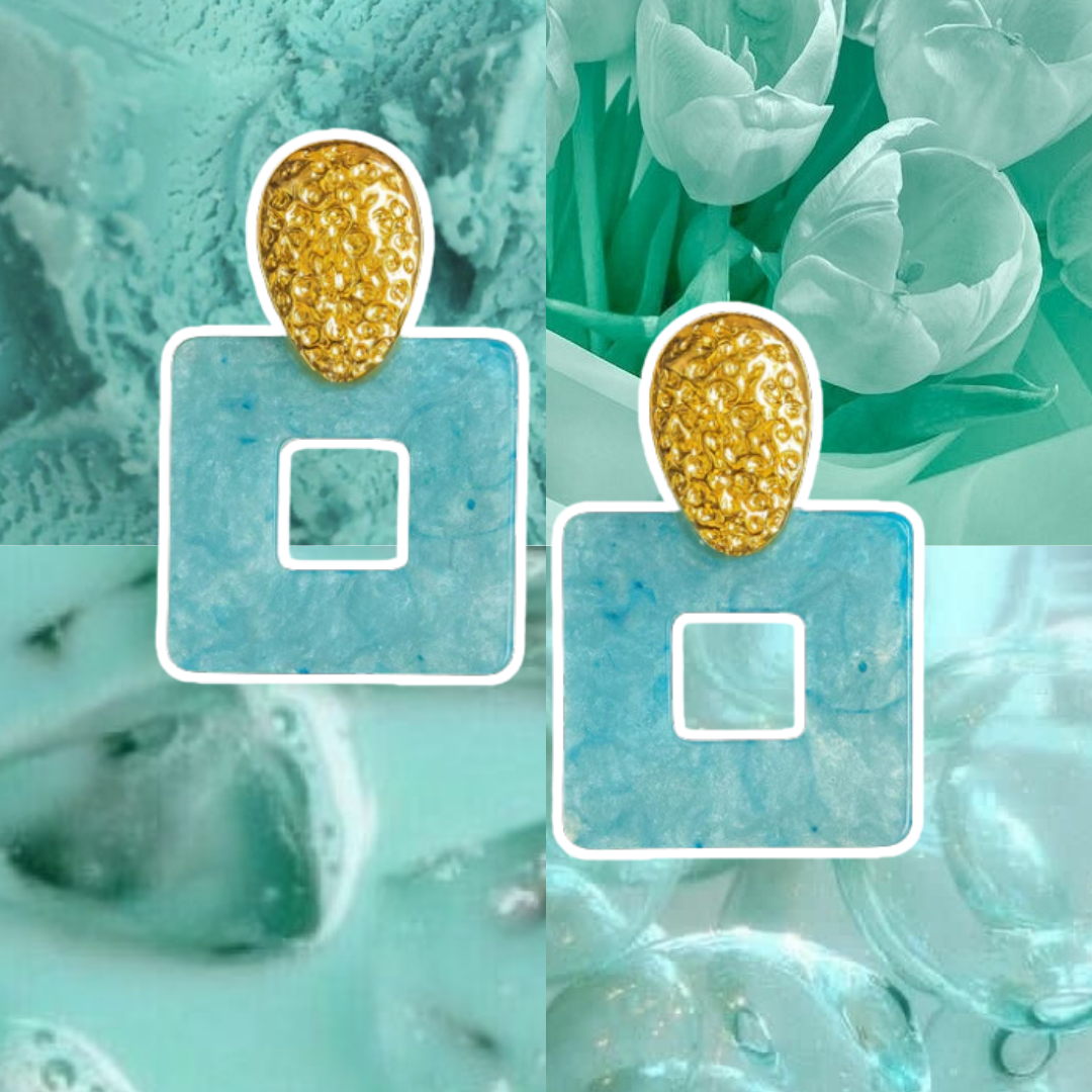 Gold earrings with square stones on a textured green background
