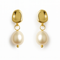 Gold earrings with pearl drops on a white background