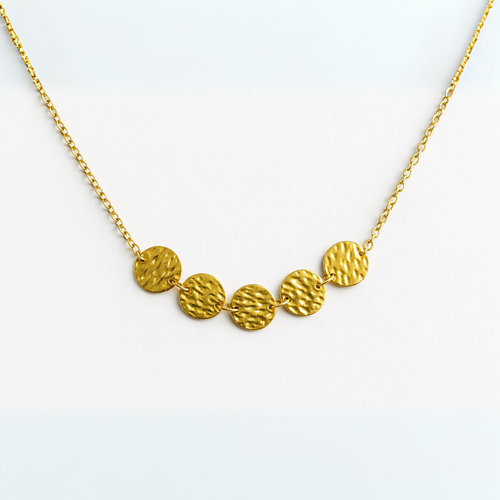 Gold necklace with circular pendants on a white background