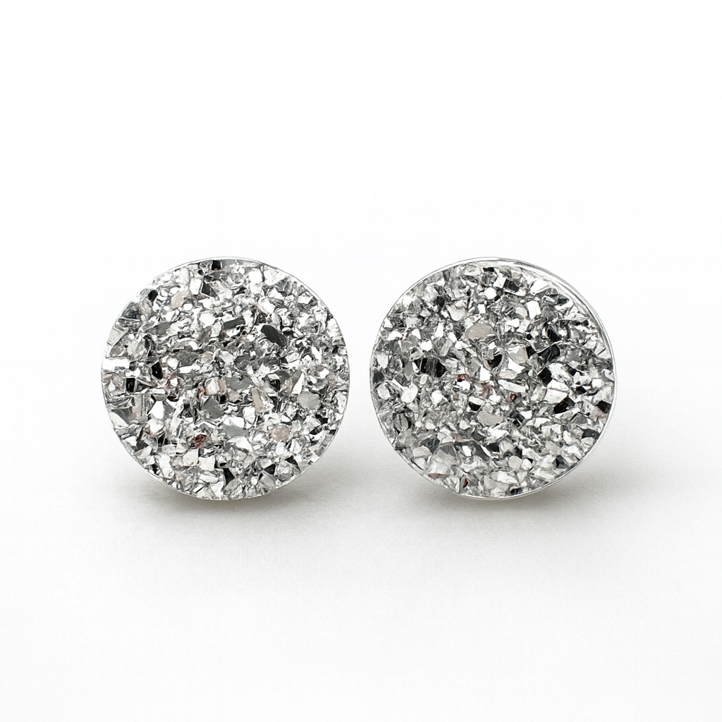 Pair of round crystal stud earrings on a white background