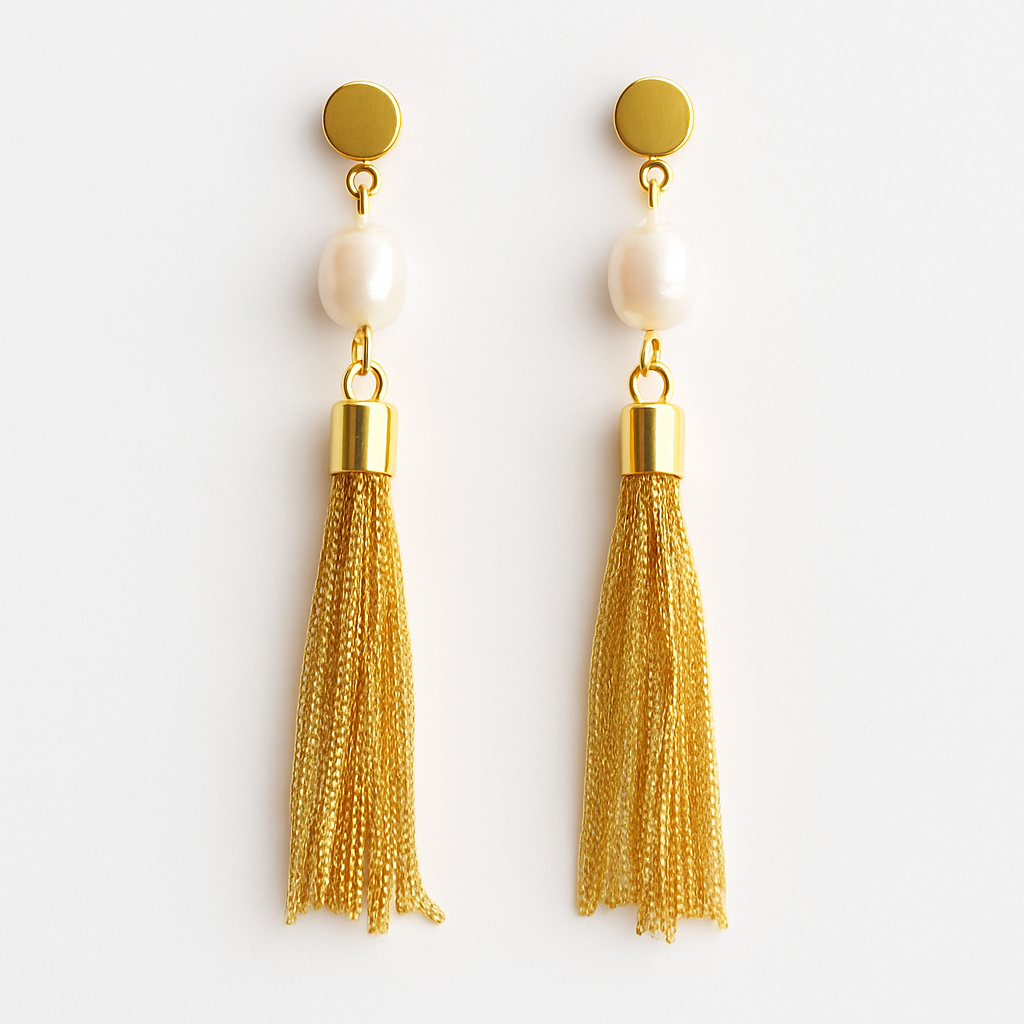 Gold tassel earrings with pearl-like beads on a white background