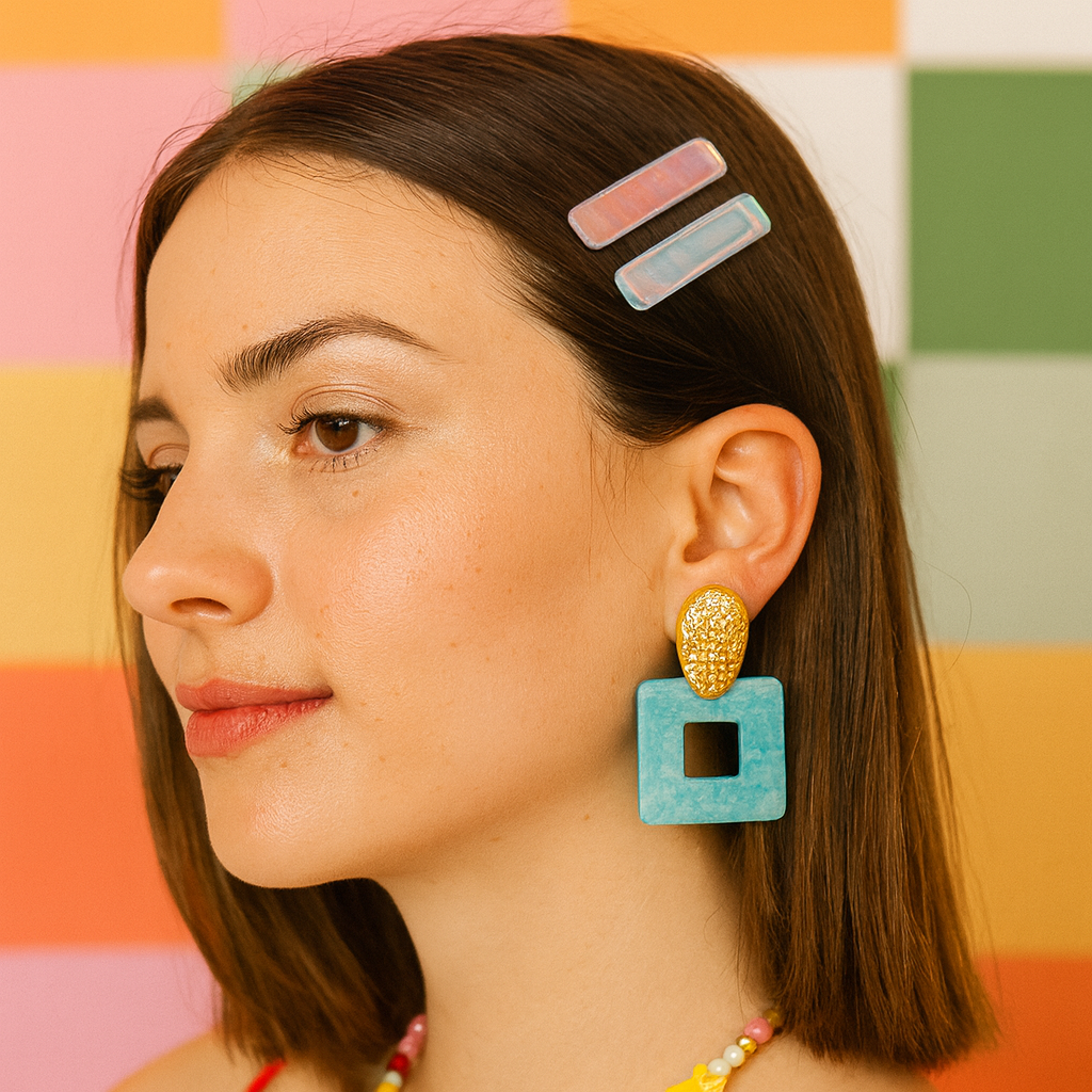 Woman wearing colorful hair clips and earrings against a multicolored background
