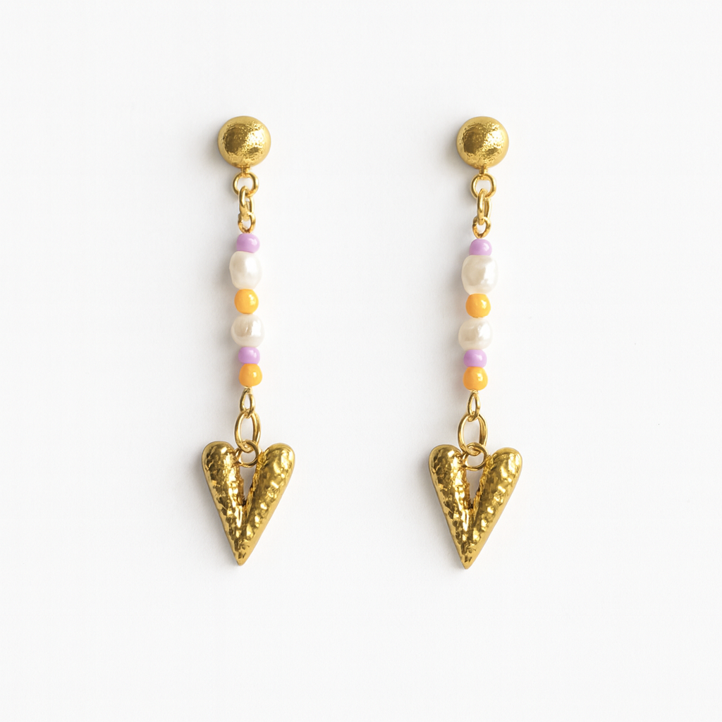 Pair of gold heart-shaped earrings with colorful beads on a white background