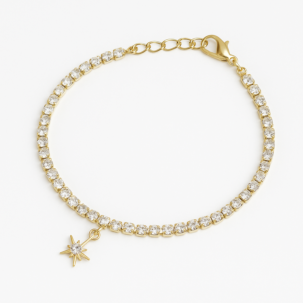 Gold bracelet with diamond accents and a star charm on a white background